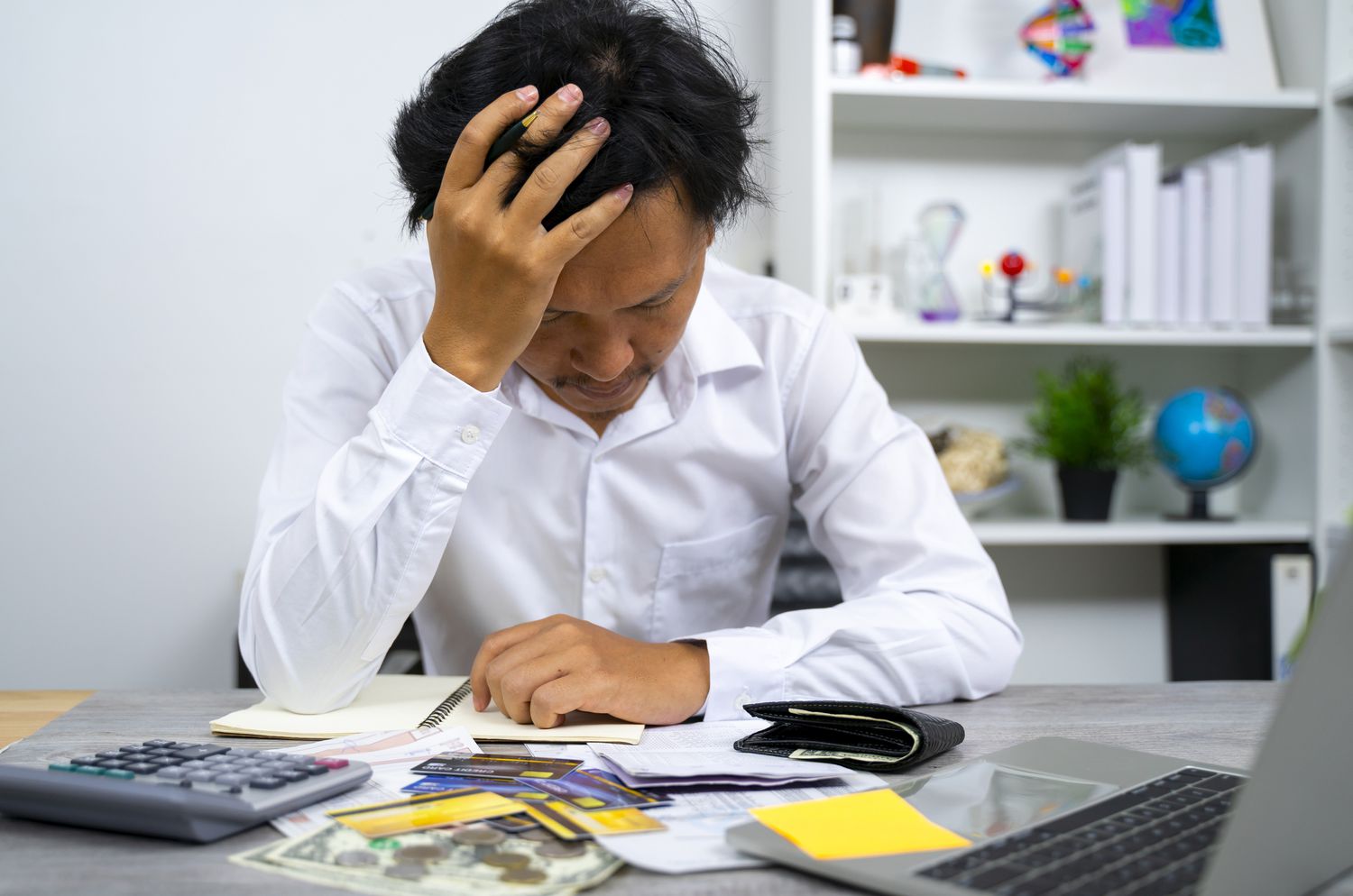 Fast business funding in Round Rock Texas for stressed small business owners reviewing finances.